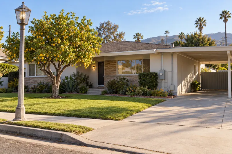 Norwalk, California: a 1950s ranch house with a carport, a lemon tree and a street light in a Los Angeles-area neighborhood