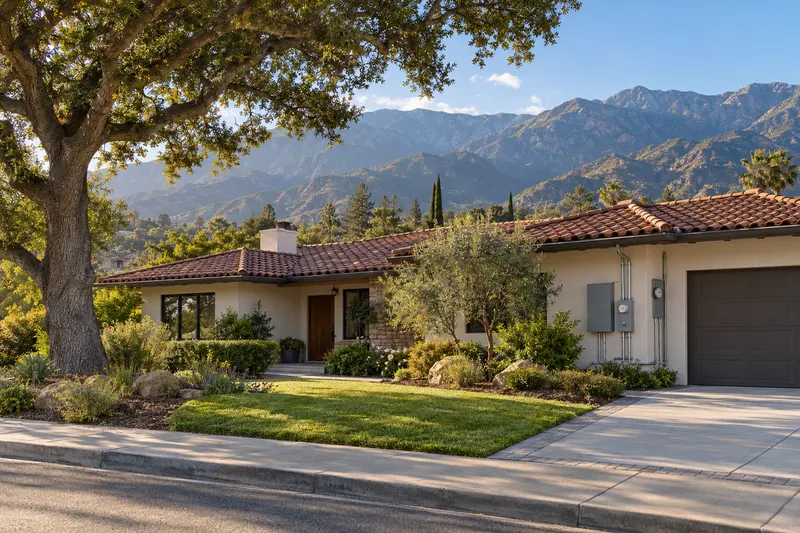 Pomona, California: a ranch home with a tile roof and an oak tree below the San Gabriel Mountains